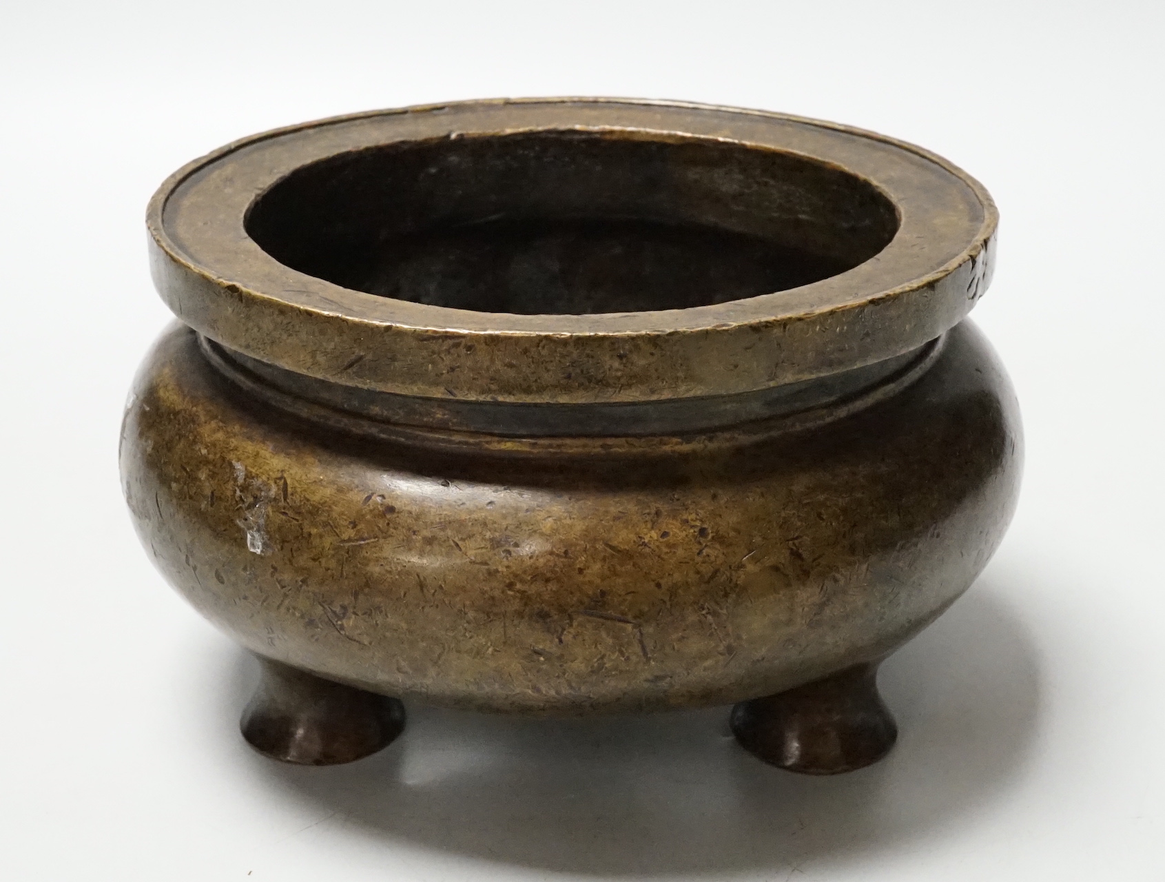 A Chinese bronze censer, ding, 14cm diameter